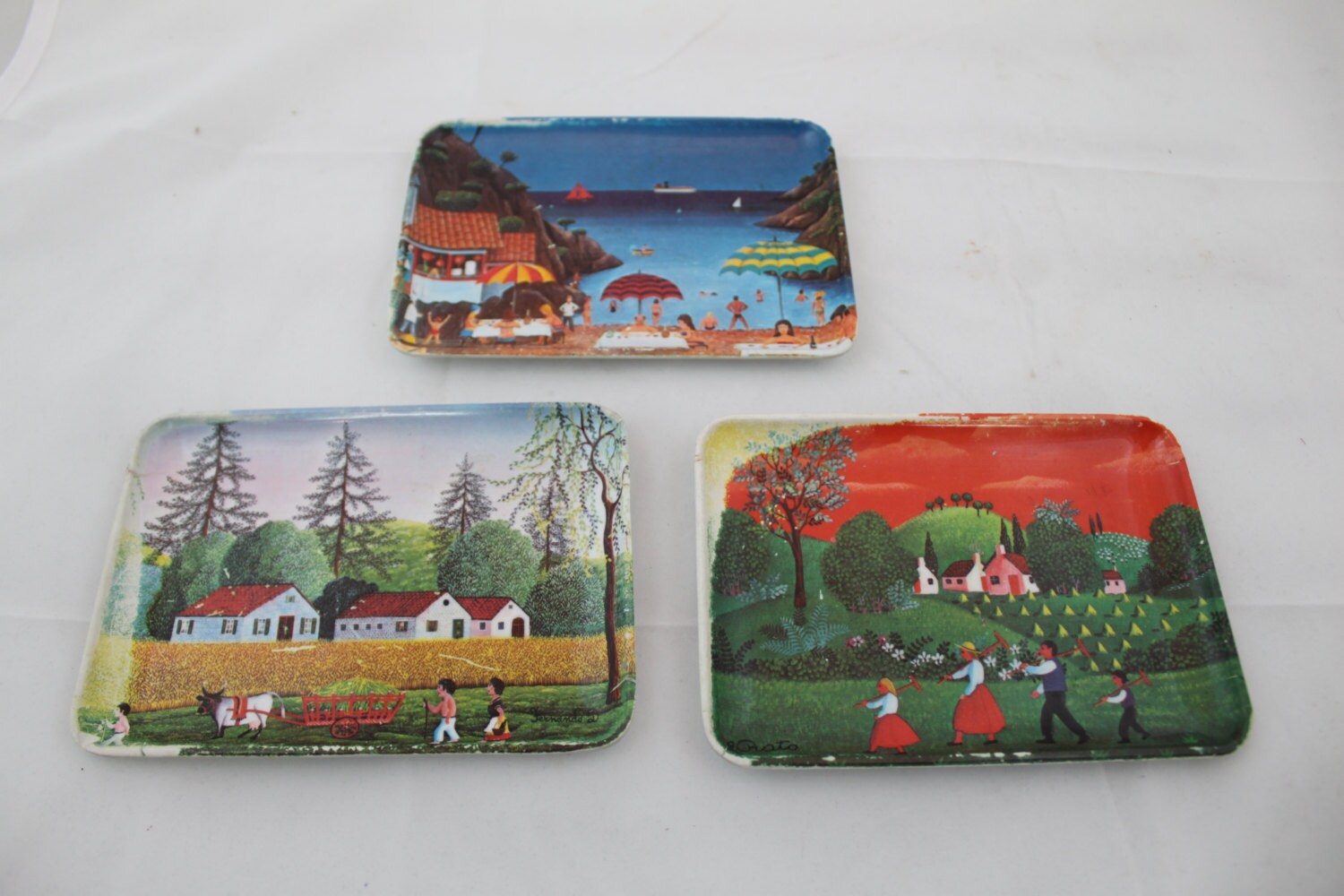 Three Small Melamine Decorative Trays or Coasters depicting three