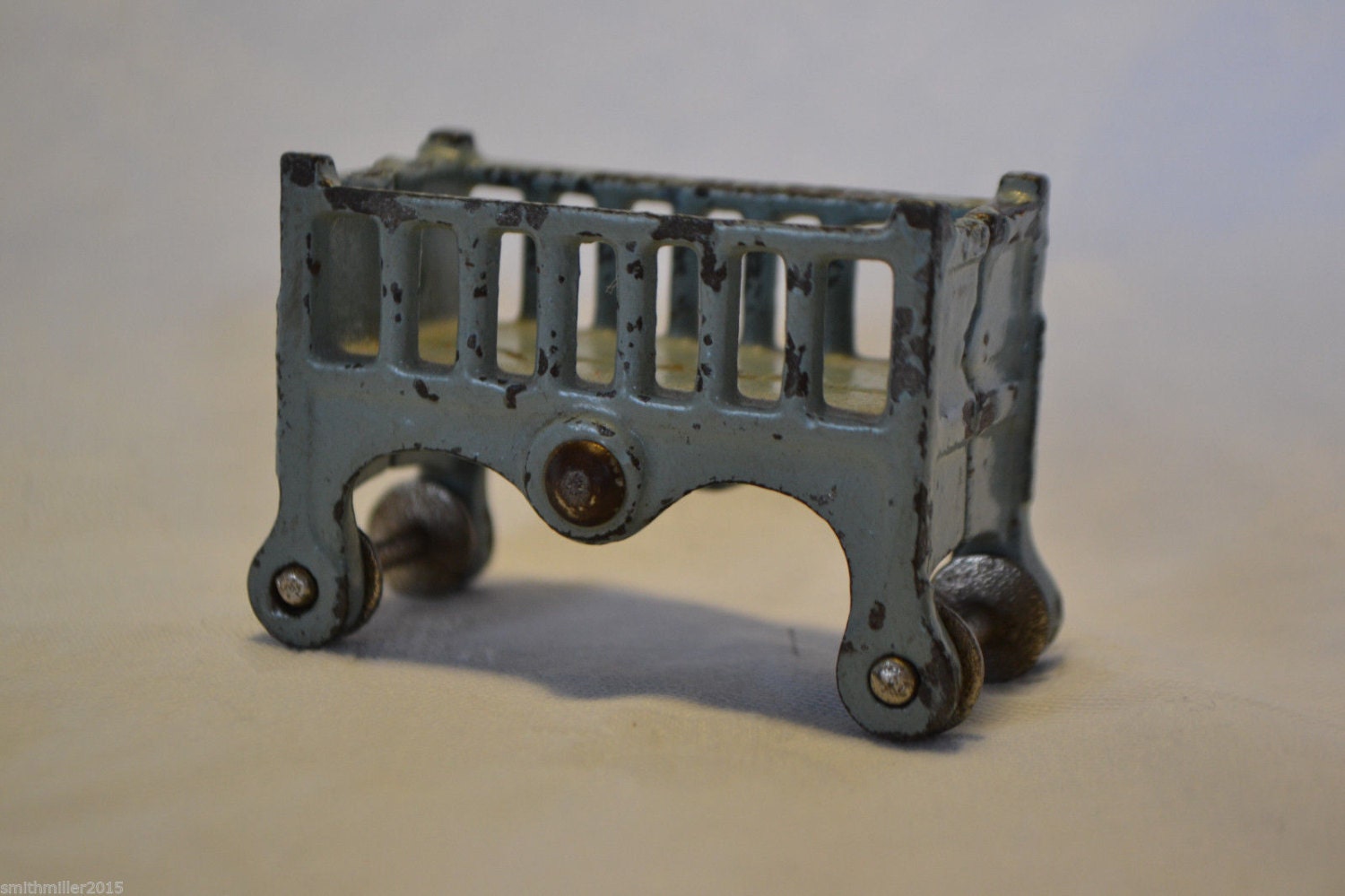 antique doll crib with wheels