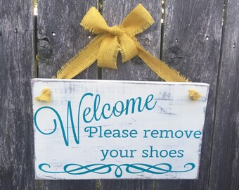 Welcome, please remove your shoes sign
