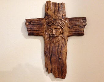 Wooden Carved Cross Bares The Image Of Jesus Christ