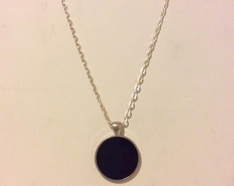 Black and silver resin round pendant necklace