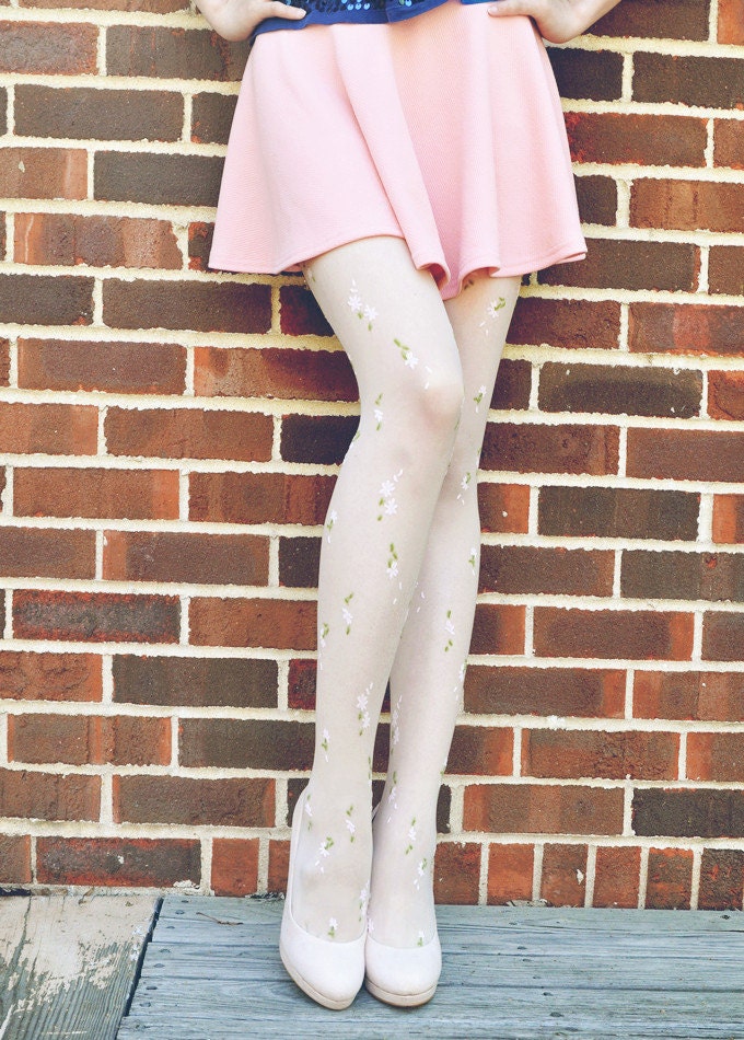 White floral tights with little green and pink flowers on it