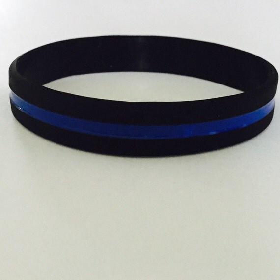 This is a thin blue line silicone bracelet by SouthFloridaLEOWives