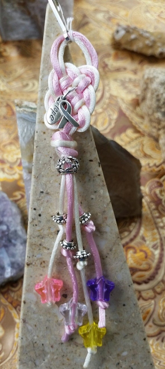 Items similar to Pink & White Celtic Prosperity Knot with Star Beads ...