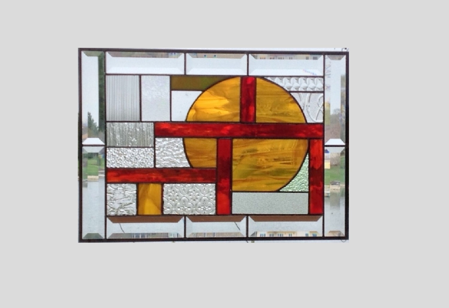 Beveled stained glass window panel amber red geometric stained