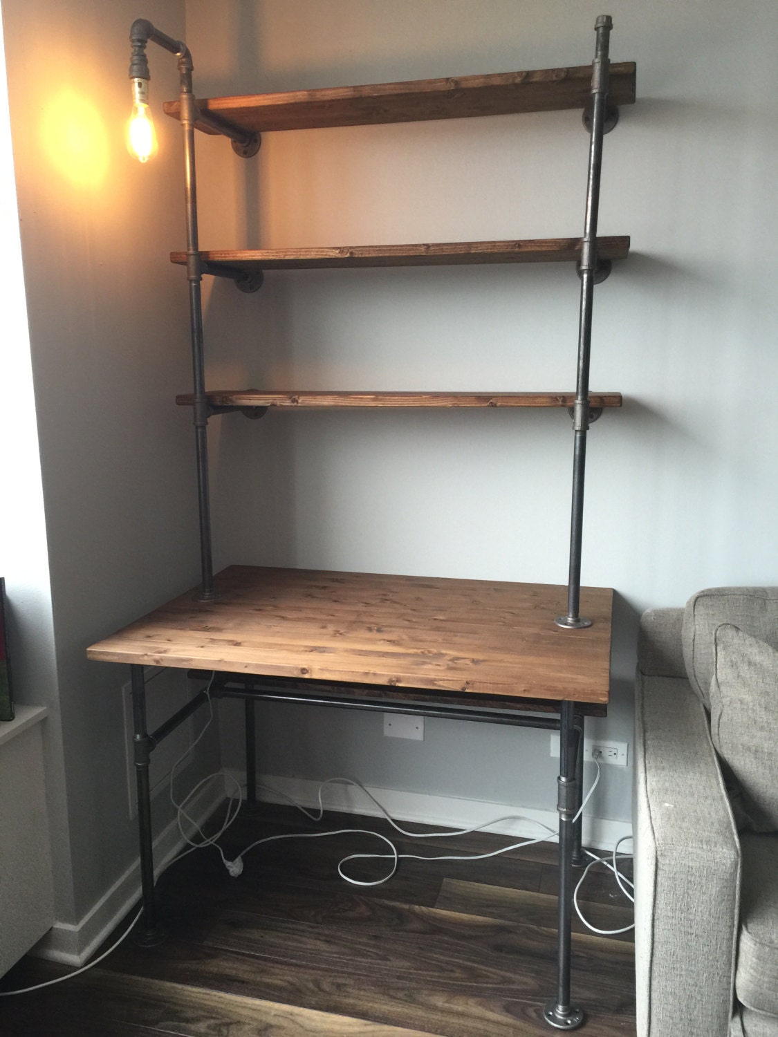 Industrial pipe desk with shelving unit and builtin lamp