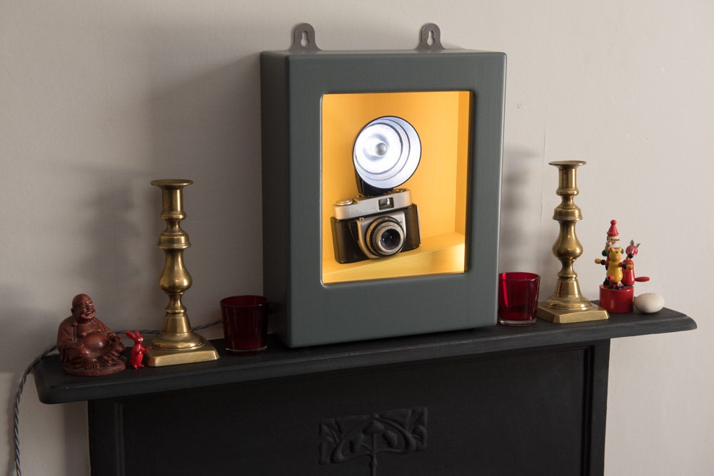 Wall light or table lamp with vintage camera and flashgun in