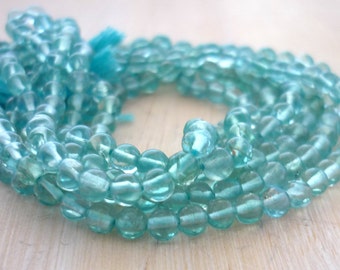 Caribbean blue apatite smooth polished rounds 3.5-4mm 1/2 strand