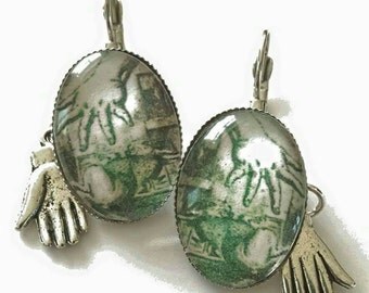 Sale was 17uk now 12uk ,150 years of Alice in Wonderland..Glove and Hand White Rabbit leverback earrings.