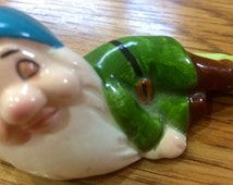 sleepy dwarf figurine