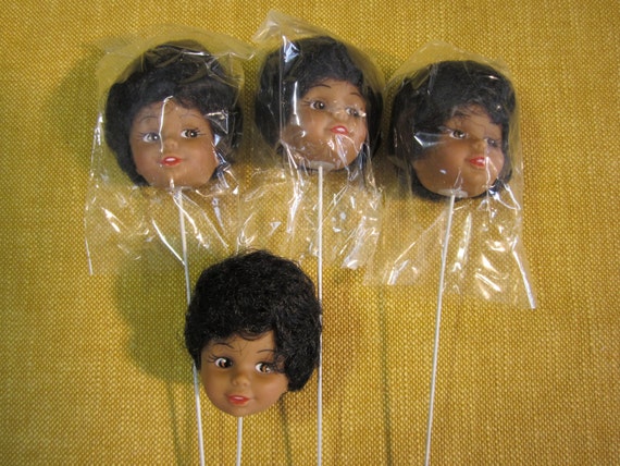 black doll heads