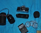 CANON AE-1 35mm SLR Manual Focus Camera w/Two Lenses, Auto Rewind and 3 Filters