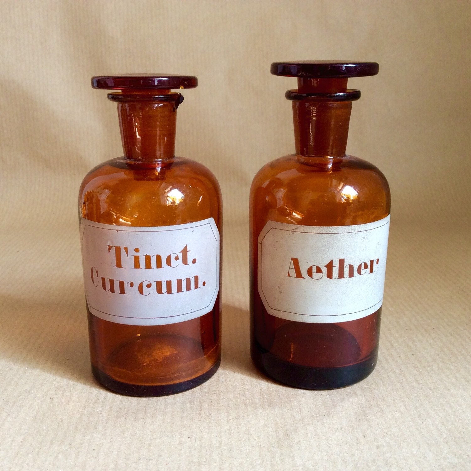 Two Vintage apothecary bottles amber glass etched label German