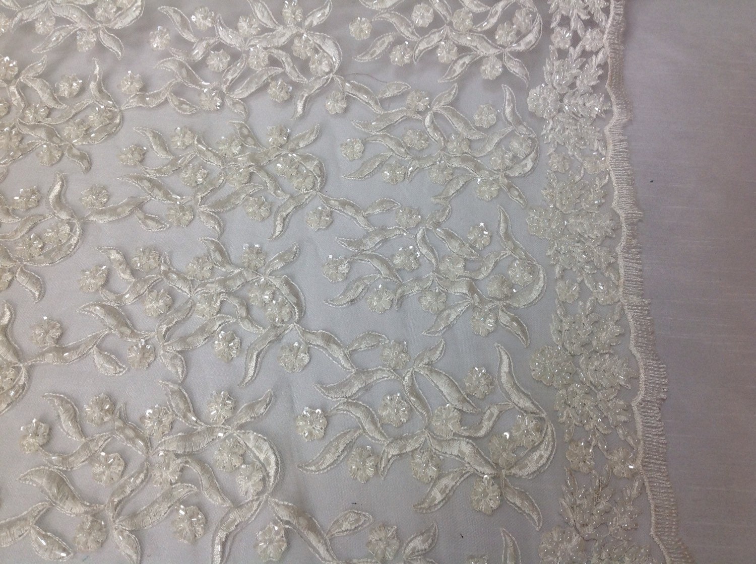 Bridal wedding beaded ivory mesh fabric lace. Sold by the