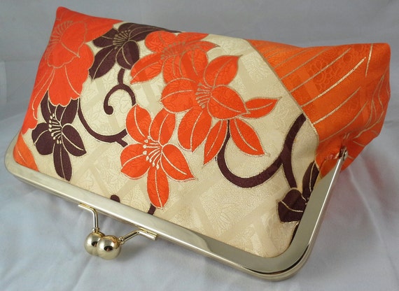 orange floral clutch bag