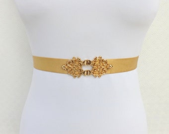 Gold Elastic waist belt. Gold vintage style filigree buckle.