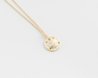 Gold charm necklace | Sand dollar necklace, Simple beach necklace, Tiny necklace, Dainty gold necklace, Gold disc necklace