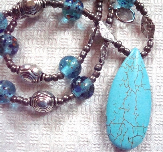 turquoise pendant necklace with glass beads and silver metal accents