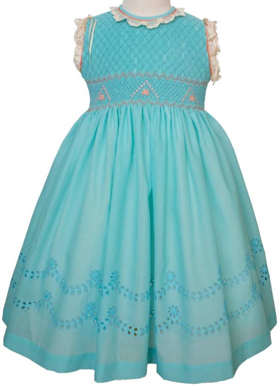 Exquisite Turquoise And Coral Dress smocking on the bodice