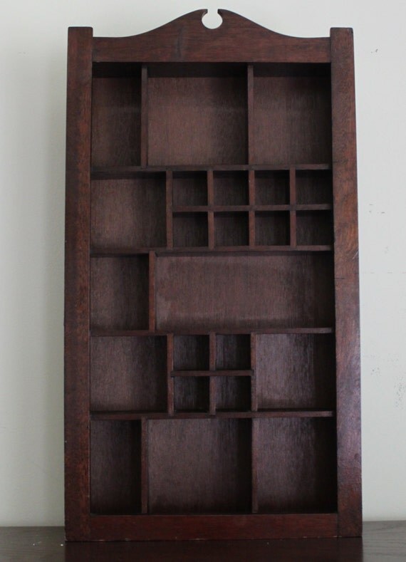 Large Dark Wood Shadow Box With 23 Various Sized Openings.