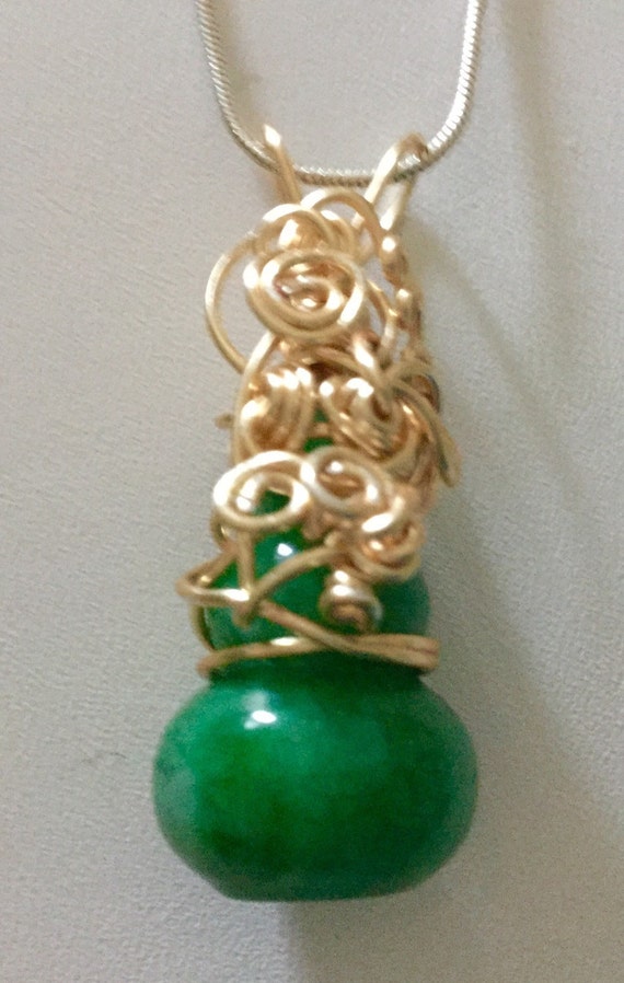 Copper wrapped jade stone pendant necklace.