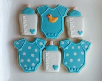 Baby boy shower, birthday party sugar cookies decorated with royal icing ,onesie ,bottle,baby face ,mini cookies and large cookie