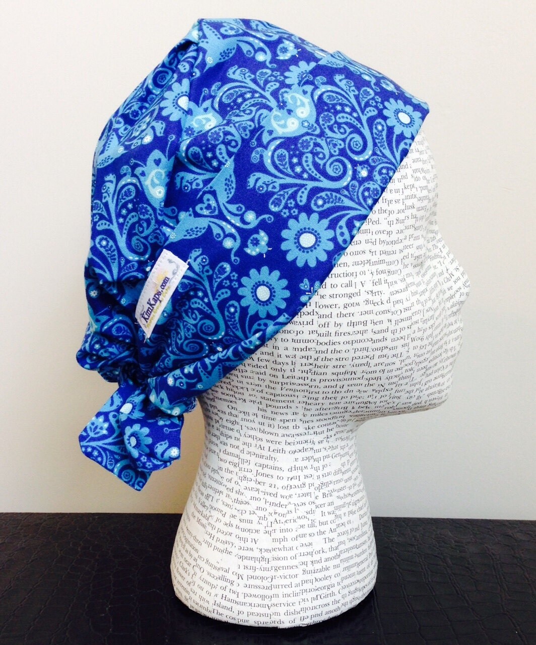 Tie Back Surgical Scrub Cap featuring blue fabric with floral