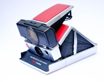 Appareil Photo Polaroid SX-70 SE Version Bouton Bleu – Collection Rare, état Correct