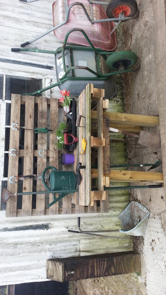 Upcycled garden work table made from reclaimed pallet wood.