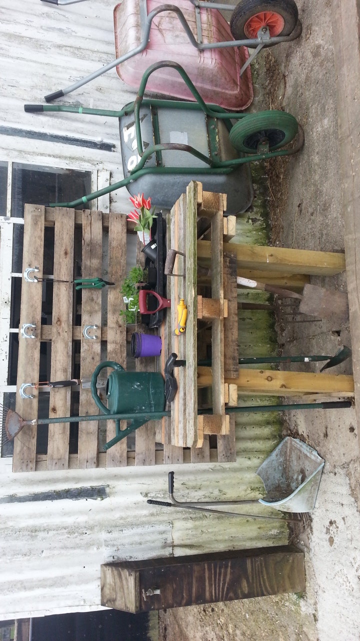 Upcycled garden work table made from reclaimed pallet wood.