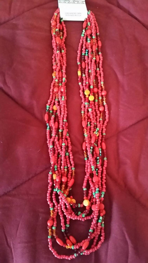 Items similar to Multi-strand red with green and orange necklace on Etsy