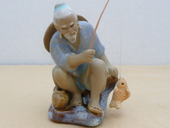 ceramic fisherman figurines