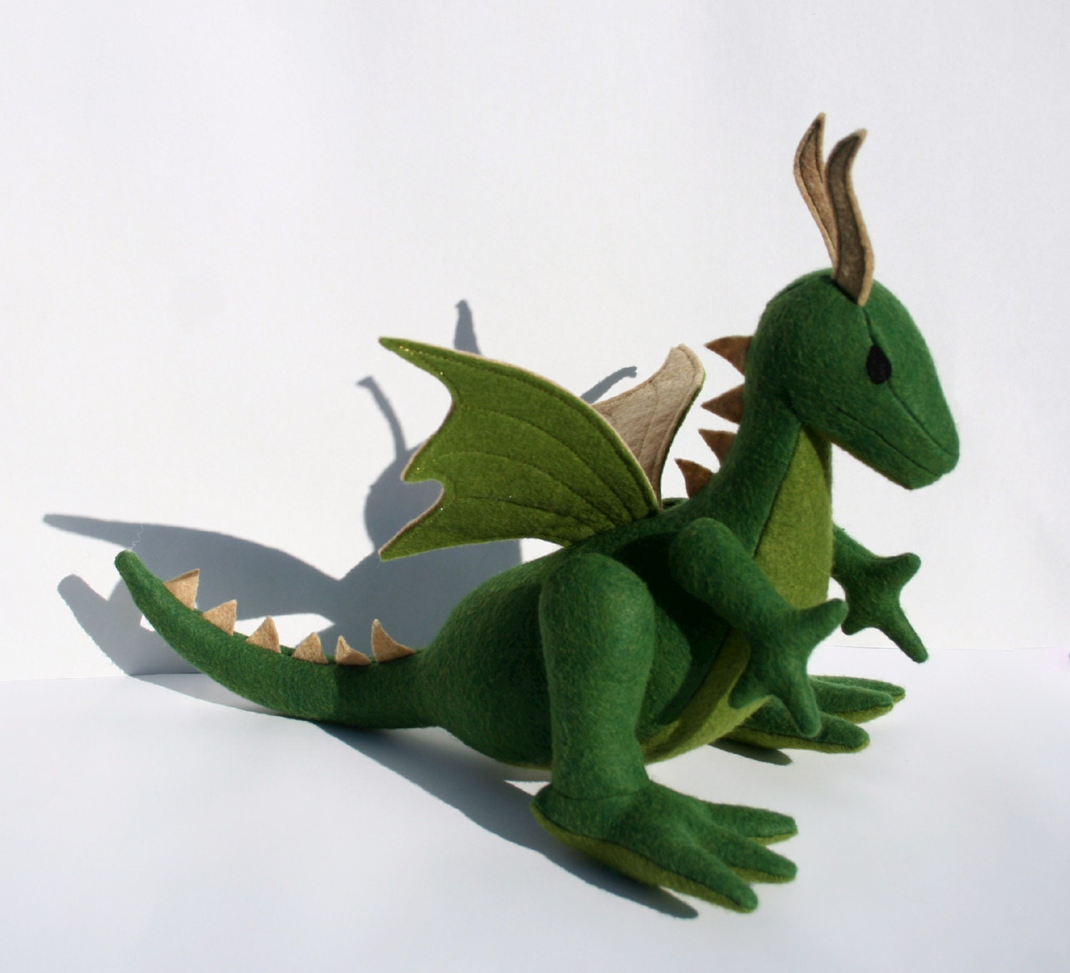 green stuffed dragon