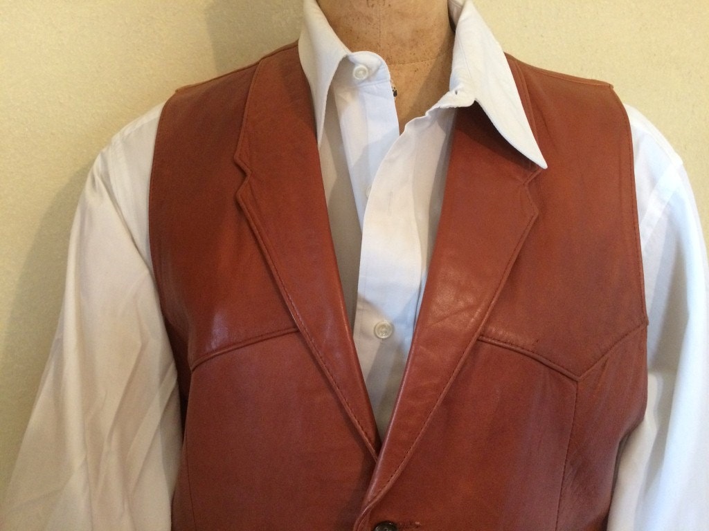 Vintage men's rust color leather vest or waistcoat from