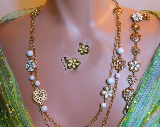 1928 necklace, bracelet and earrings, gold chain, enamel flowers, flowers with rhinestones, floral discs and floral and plain cream beads