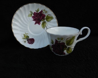 Vintage Tea Cup and Saucer: Hand decorated porcelain