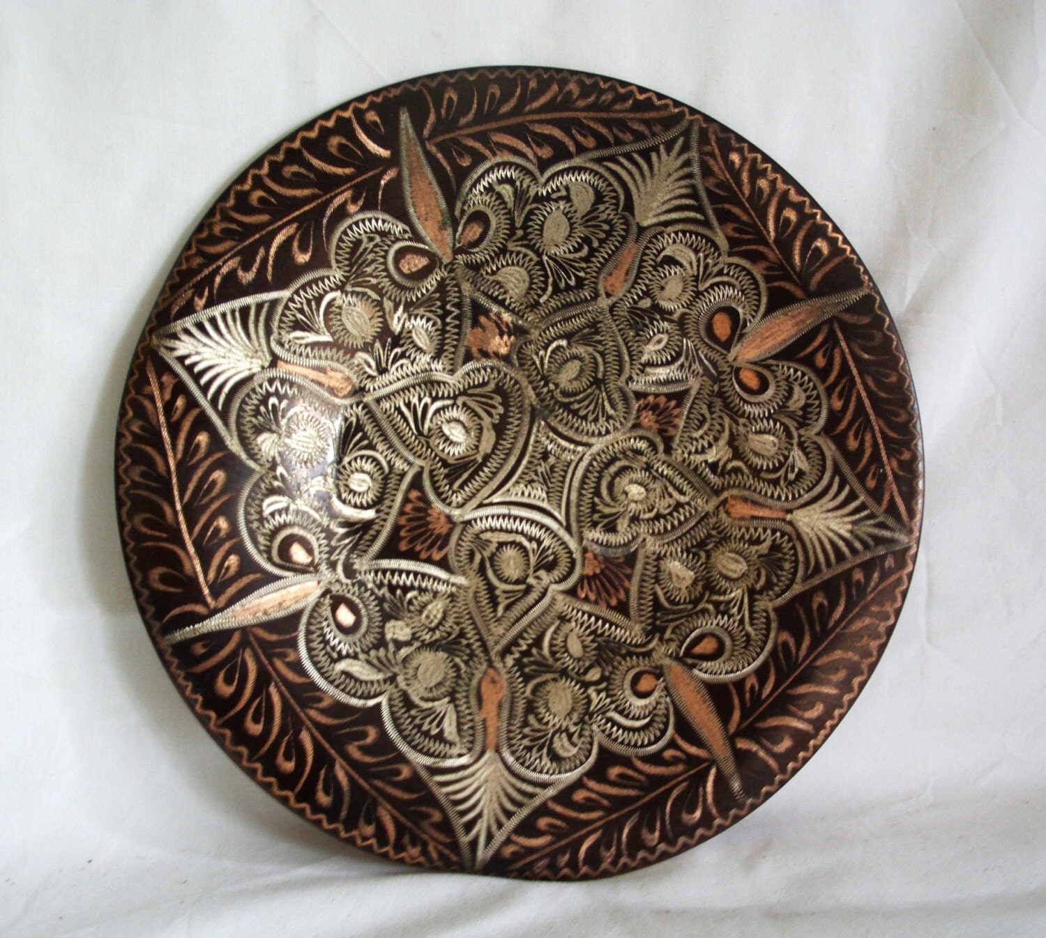 Vintage copper plate wall hanging. Intense detailed folk art