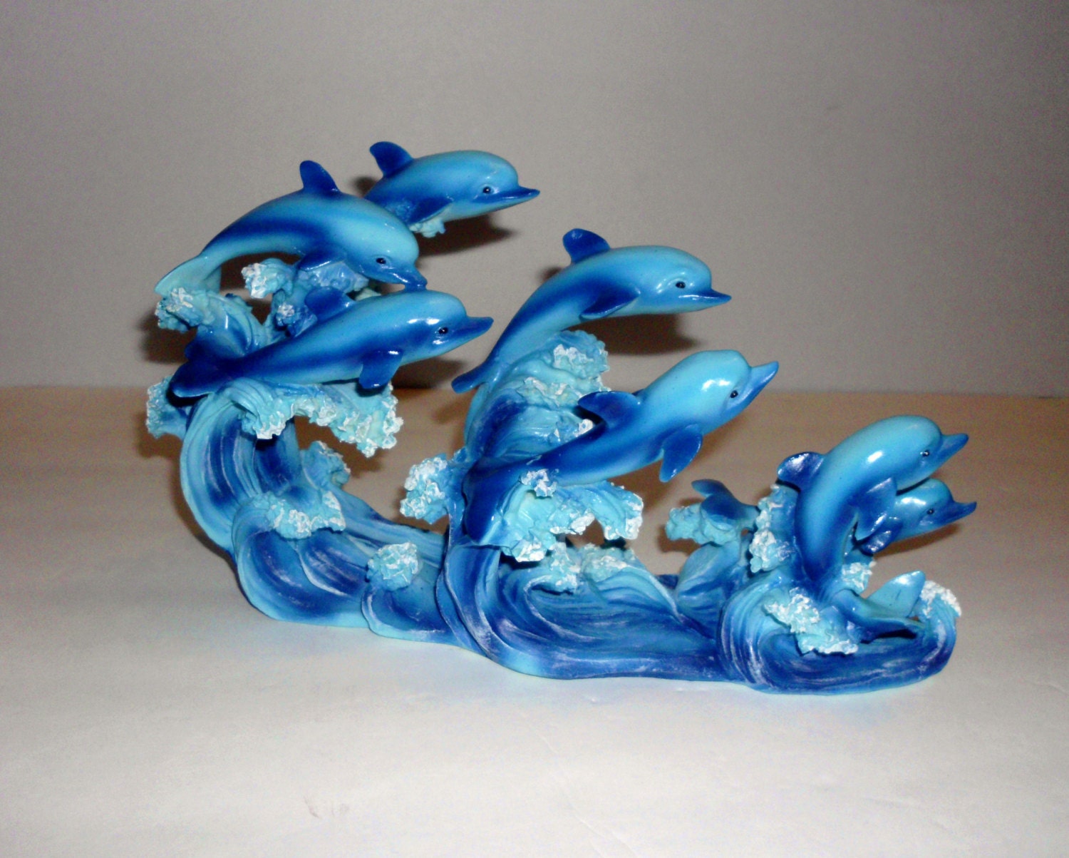 resin dolphin statue