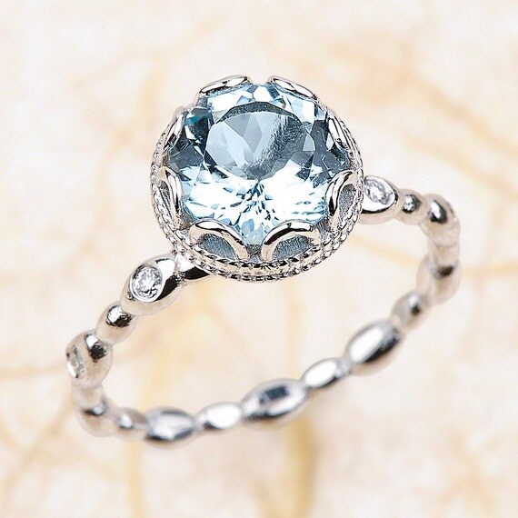 Engagement rings with aquamarine side stones