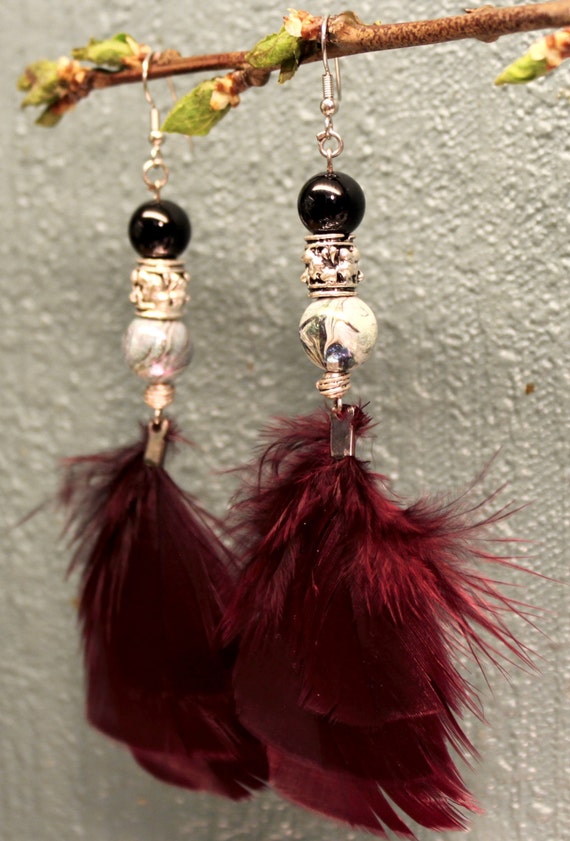 Items similar to Layered turkey feather earrings on Etsy