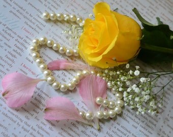 Yellow Rose and pink petals