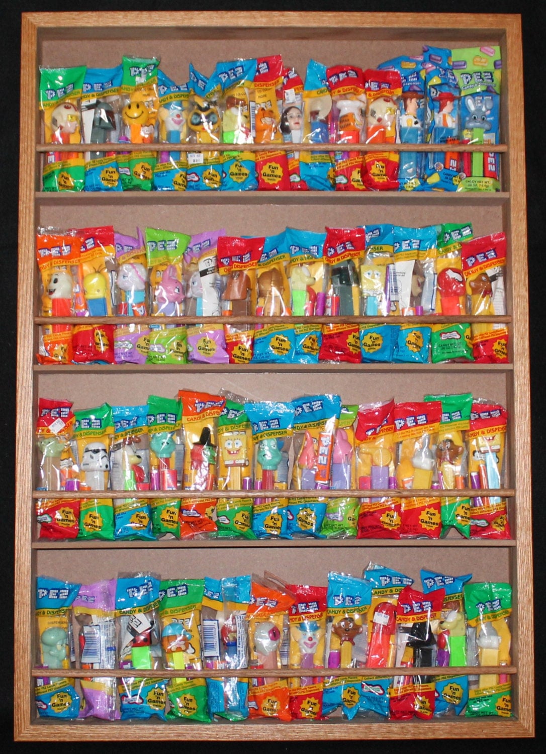 PEZ dispenser display case holds 60 in bags without door
