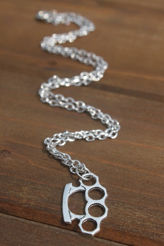 Items similar to brass knuckles necklace on Etsy