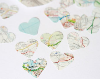 Heart shaped map confetti, made using genuine map and atlas pages, each 1 inch heart hand stamped