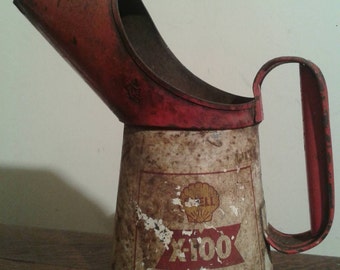 old vintage shell x100 oil jug garage advertising
