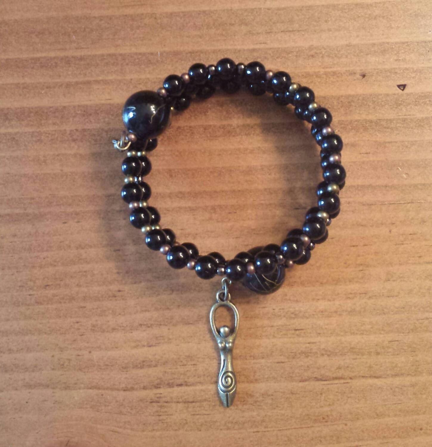Black Glass Bead Goddess Bracelet on Brass Memory Wire