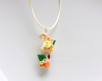 Fairy house necklace in peach and yellow handmade from polymer clay