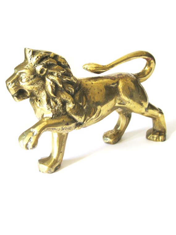 A Large Lion Sculpture In Solid Brass