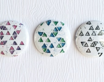 3 badges 1 "Mixed media Triangles