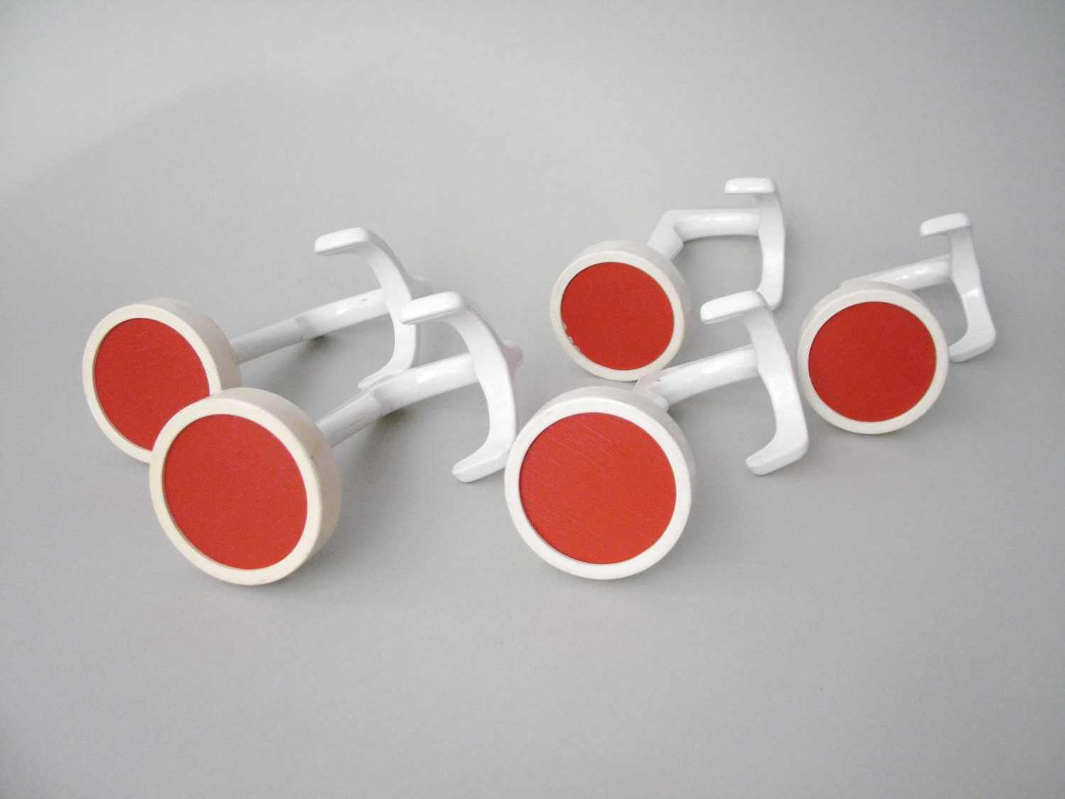 Vintage midcentury modern set of 5 round red coat hooks with a metal